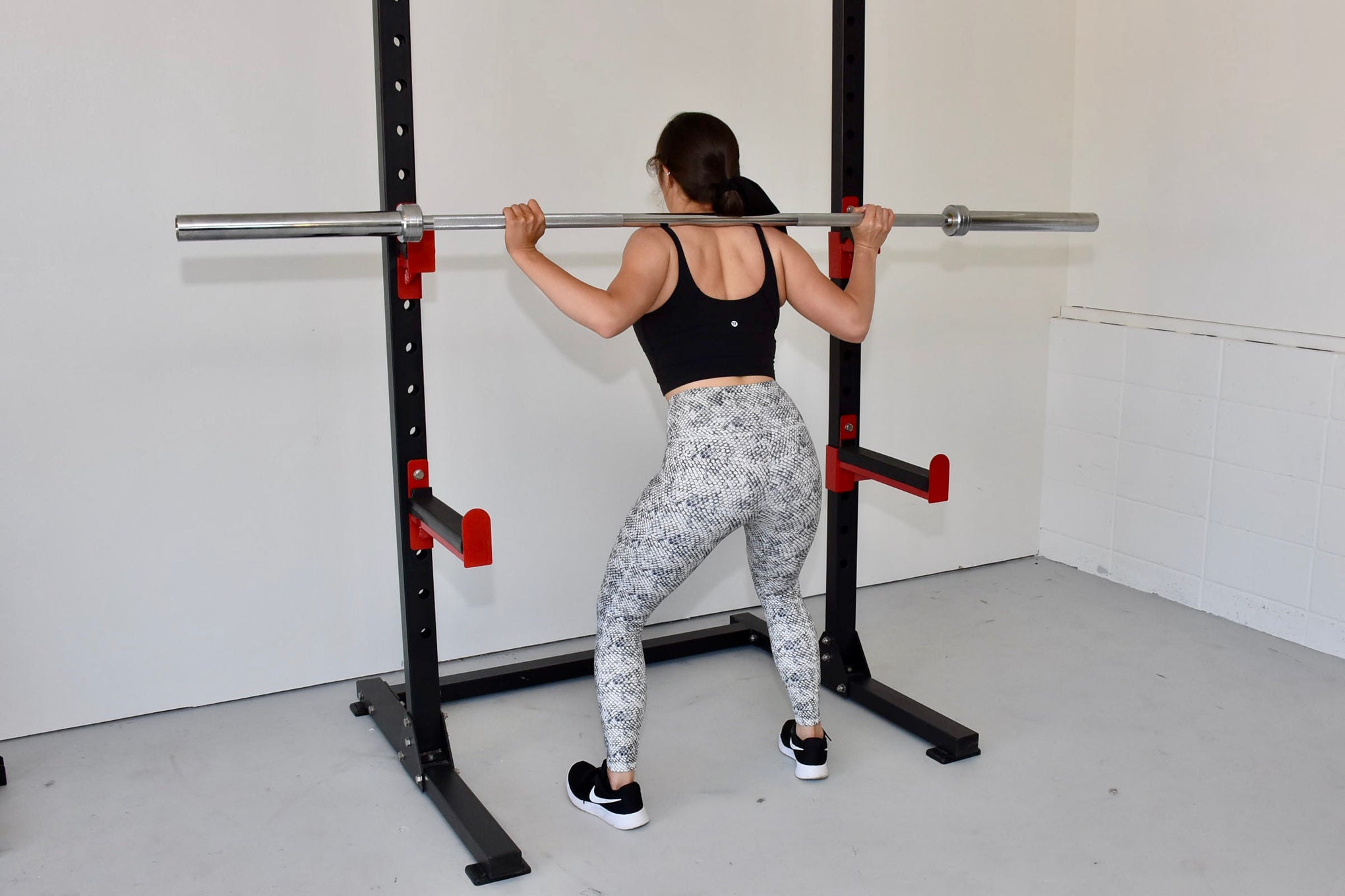Commercial grade multifuction squat rack and Commercial grade stainless steel olympic barbell.